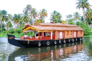 Tourists enjoying a houseboat ride on Alleppey backwaters
