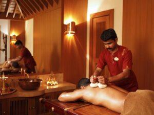 Ayurvedic therapy with herbal oils in Kerala wellness center