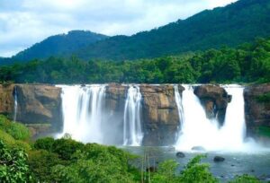 Majestic Athirappilly waterfalls surrounded by greenery in Kerala